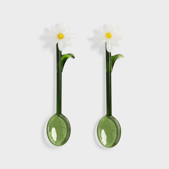 Teaspoon set from &Klevering featuring a daisy flower detail and green glass construction.