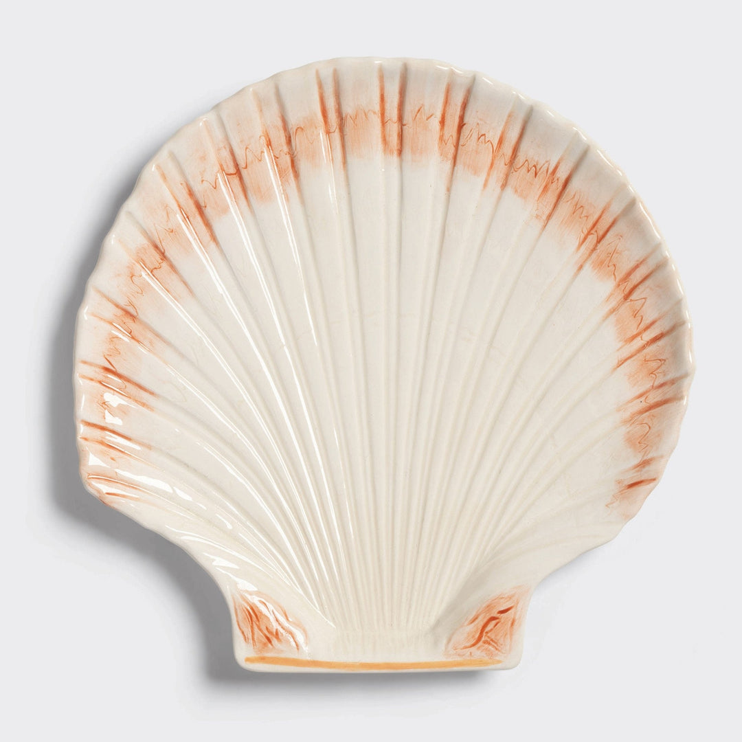 Shell serving plate by &klevering with decorative, sketched-style coral coloring.