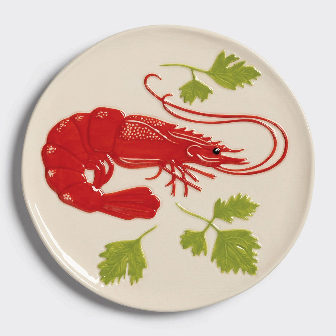 Decorative tableware plate from &Klevering with an embossed red shrimp and green sprigs design.