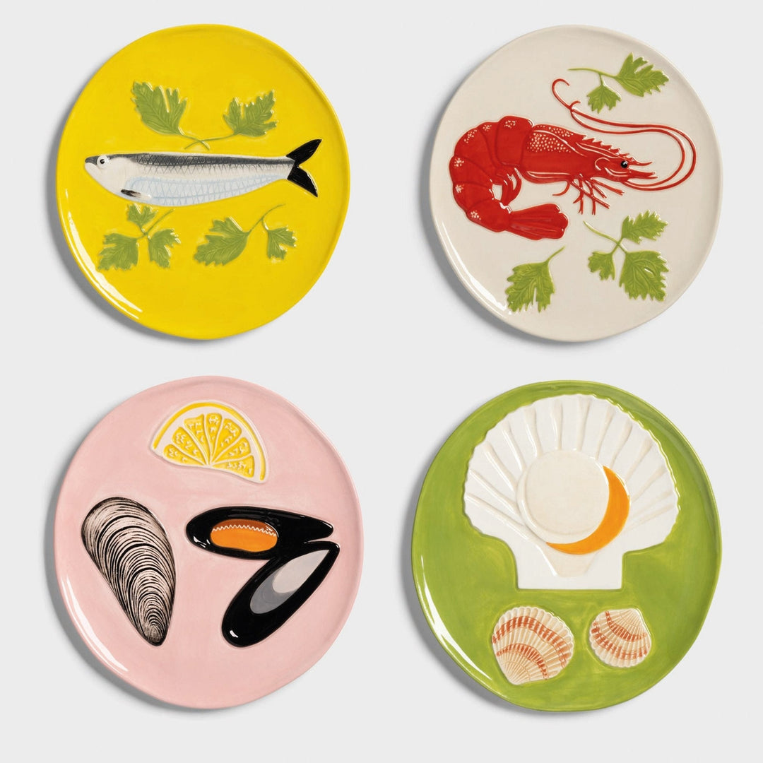 Set of four decorative plates by &Klevering, each with colorful sea life designs.
