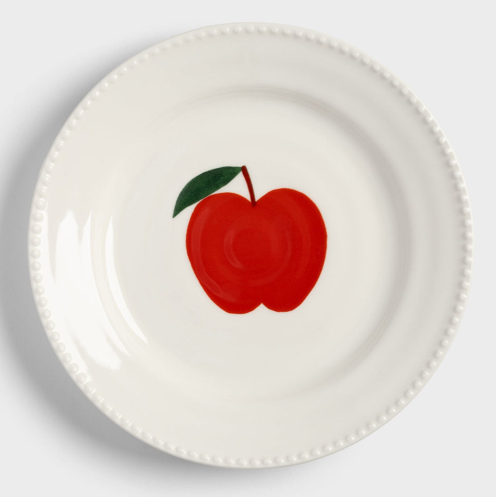 Decorative plate with apple design by &Klevering, featuring a beaded rim.
