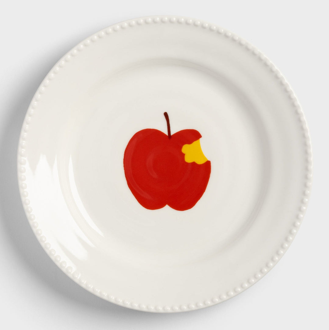 Decorative plate with apple design by &klevering, featuring a bite mark and beaded rim.
