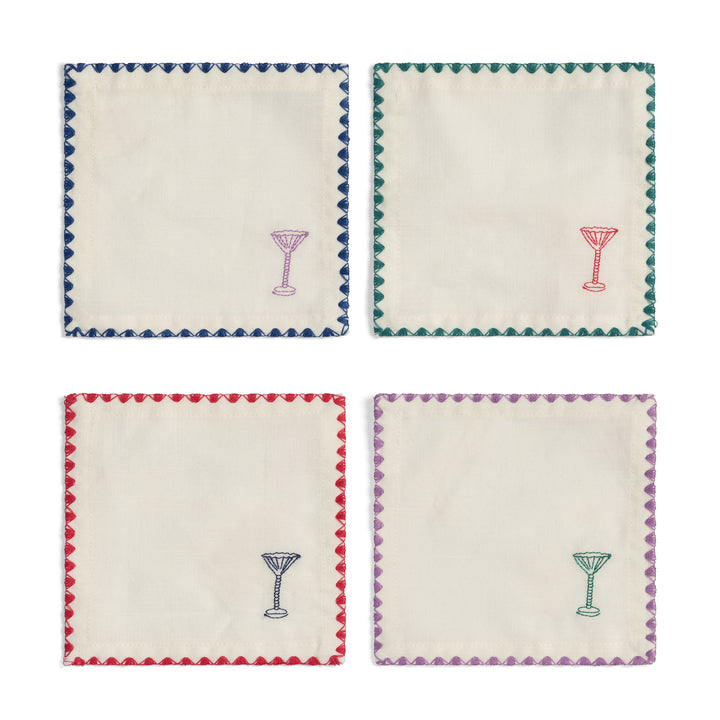 Set of four white cocktail napkins by &Klevering, each with colorful zigzag border and matching glass embroidery.
