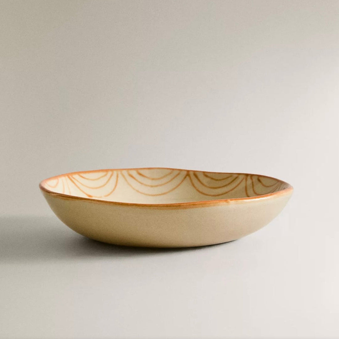 Painted earthware salad bowl by Nanushka, with scalloped line decorations along the inside rim.