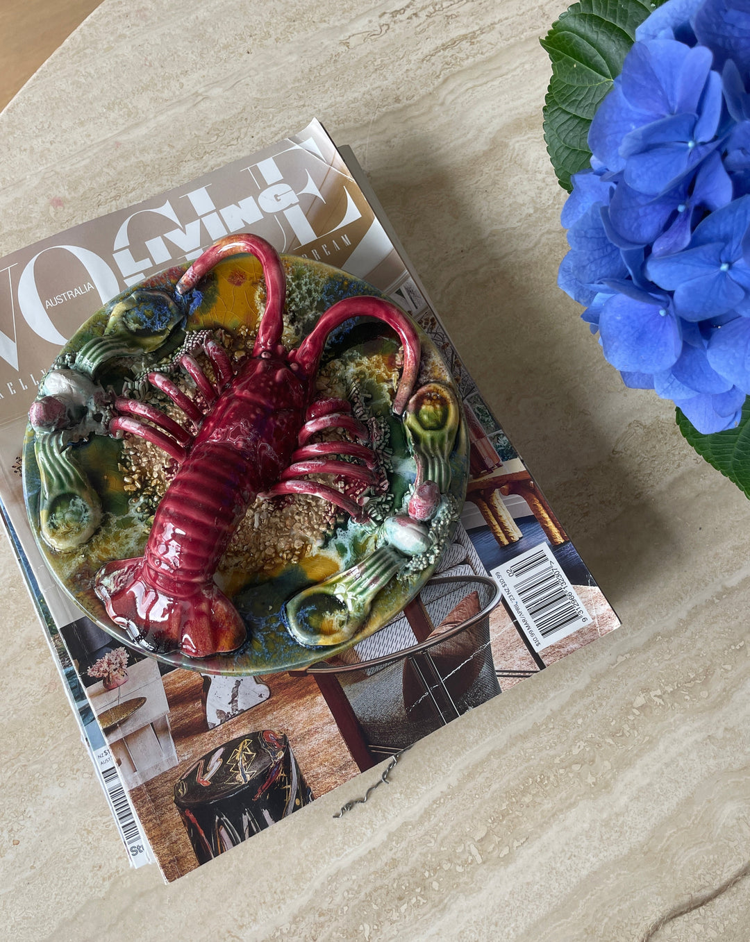 Majolica Palissy ware lobster plate from the 1940s, featuring a red crustacean on a textured, glazed surface.