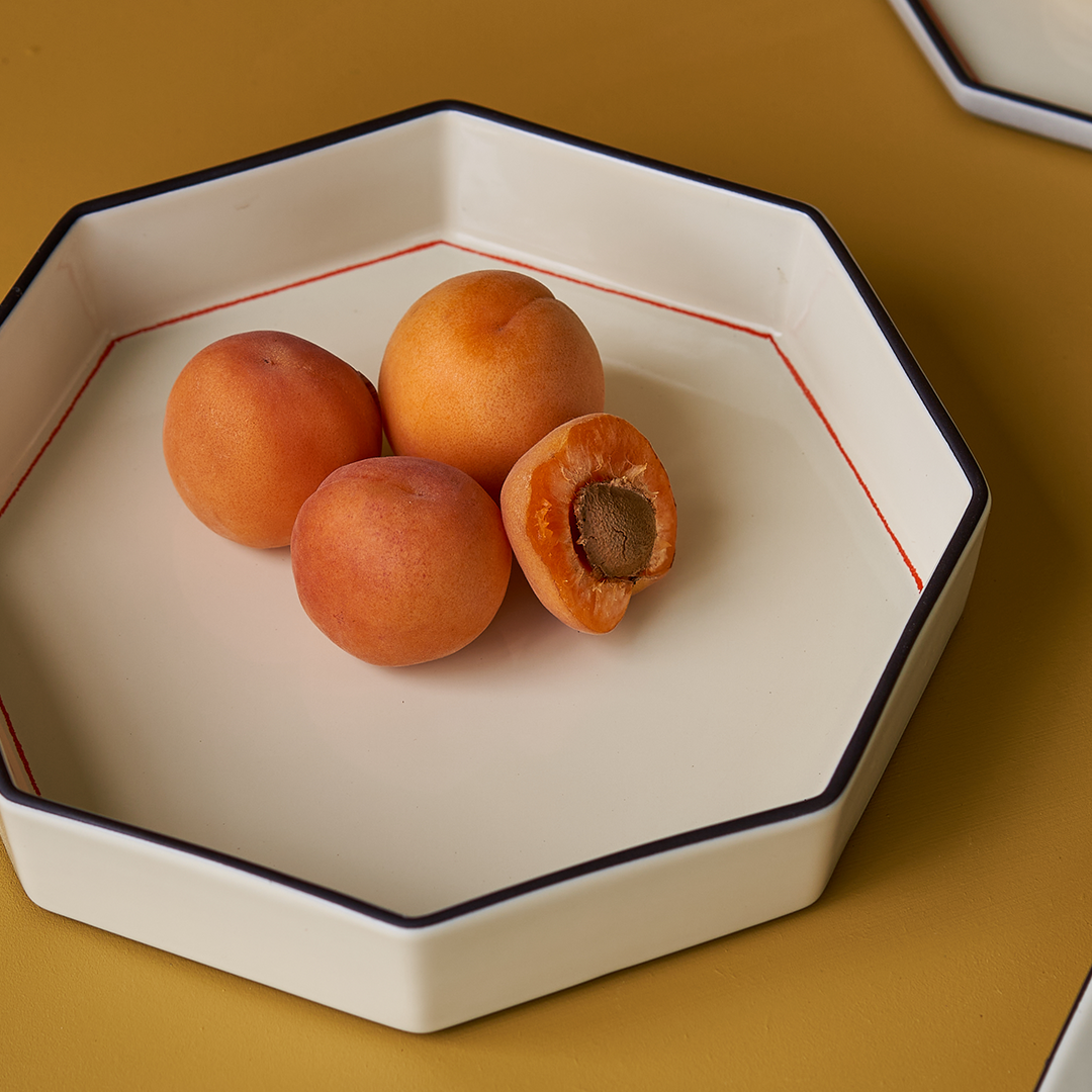 Editorial image of the Gem bowl in ivory by Black Blaze and from Shop Dessein parke with apricots in it