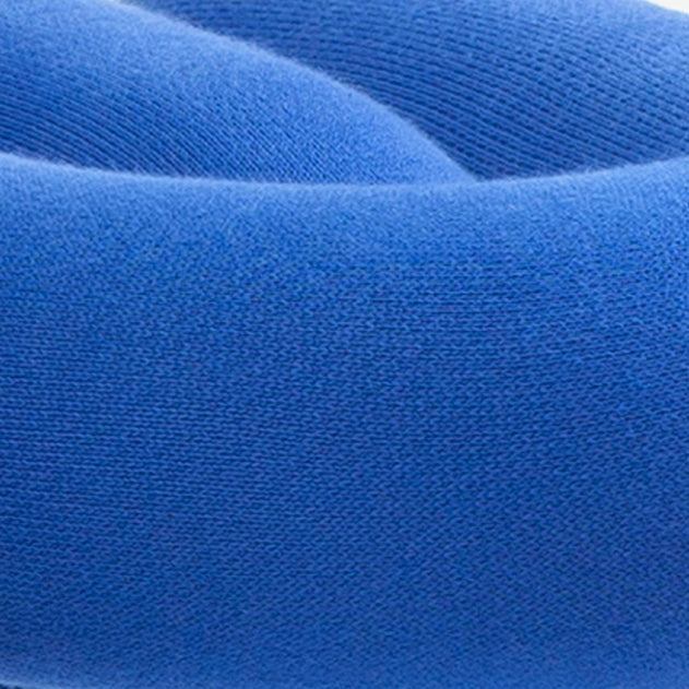 Blue fabric bench with a textured surface.
