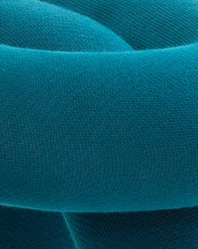 Purple stool with woven texture.