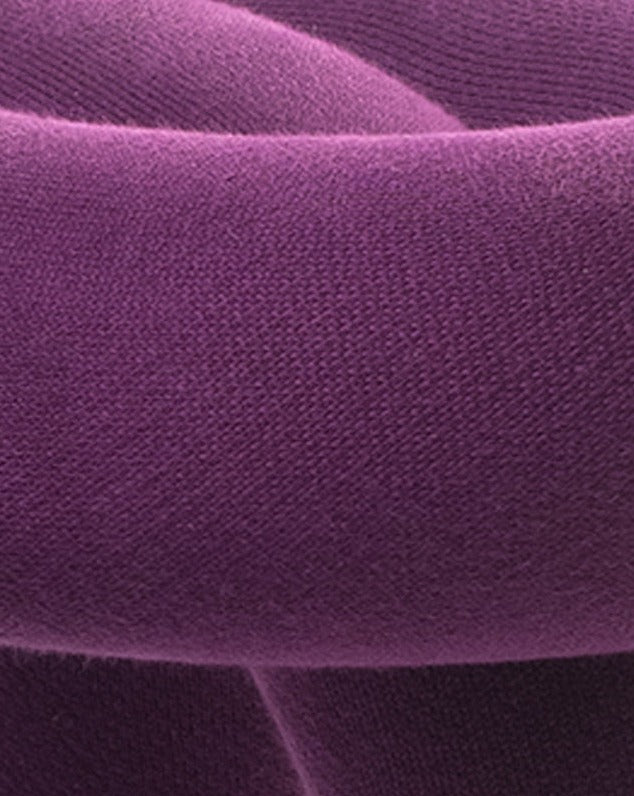 Purple stool with a textured, woven fabric.