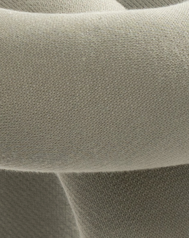 Cropped view of a purple stool by Moustache with a textured fabric covering.