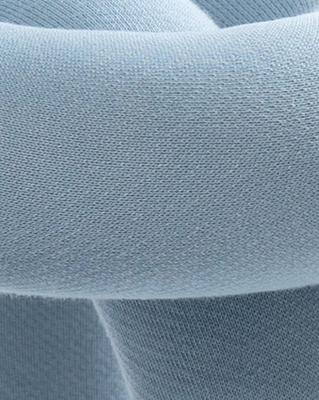 Purple stool with a smooth, knitted texture.