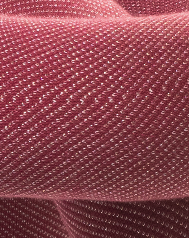 Purple stool with textured detailing.