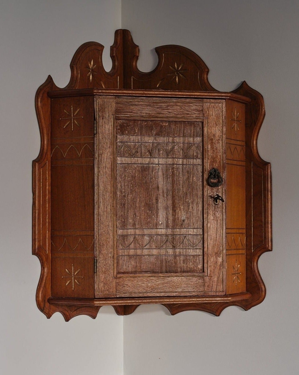 Gorgeous little elaborately detailed Arts and Crafts corner cabinet. Perfect for wine or glasses storage, and has a key for locking things away