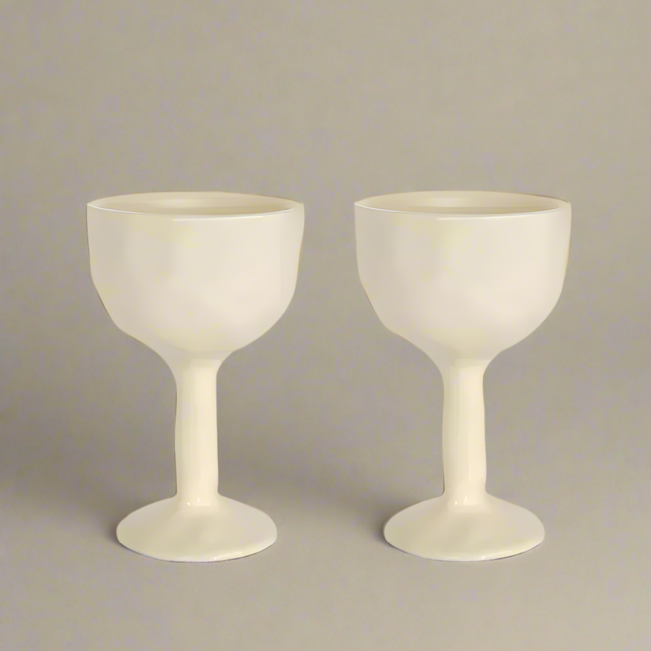 two ivory coloured ceramic goblet glasses by Black Blaze and available from Shop Dessein Parke