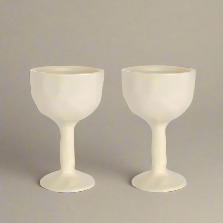 two ivory coloured ceramic goblet glasses by Black Blaze and available from Shop Dessein Parke