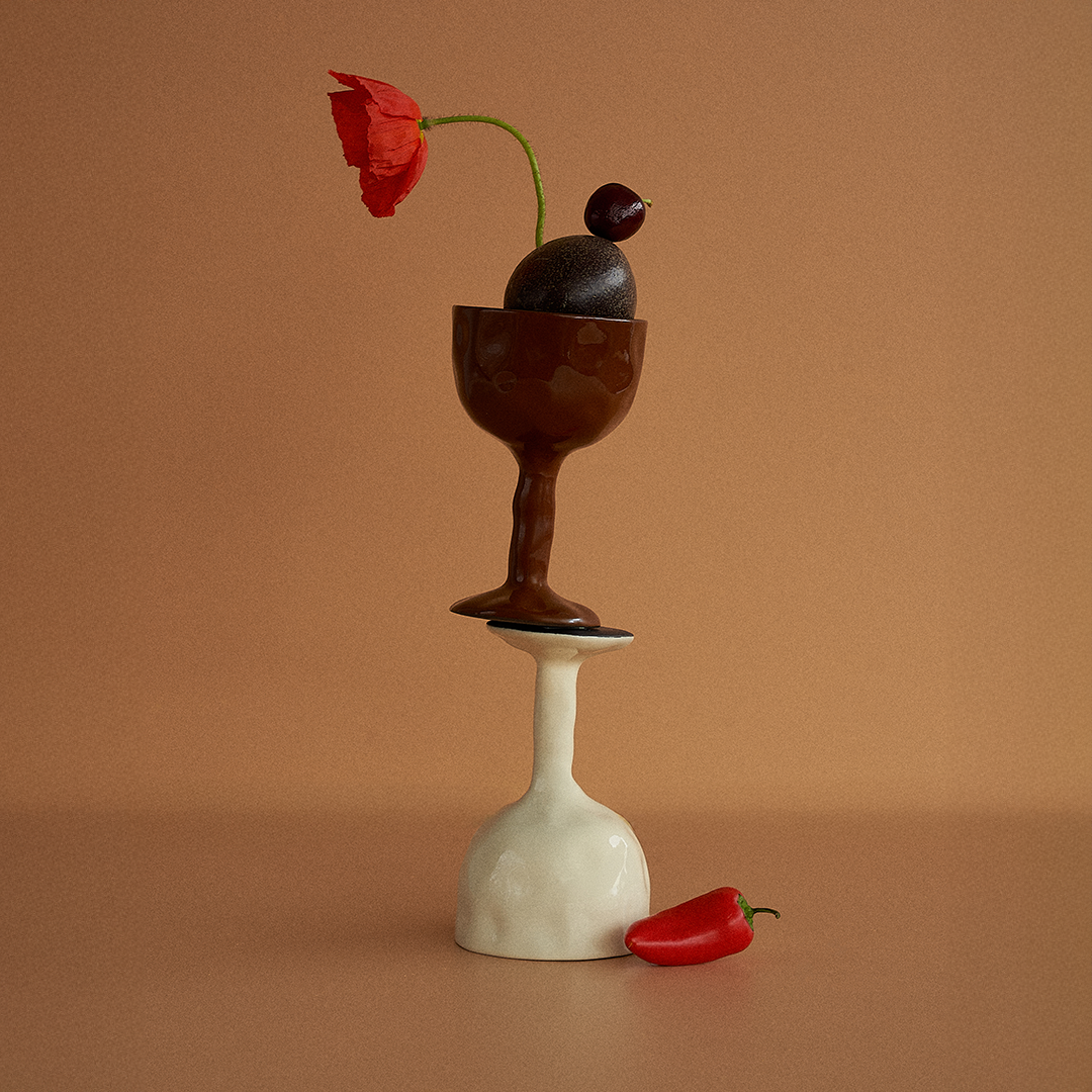 Rust coloured Drift goblet by Black Blaze artfully stacked on top of white one, available from Shop Dessein Parke