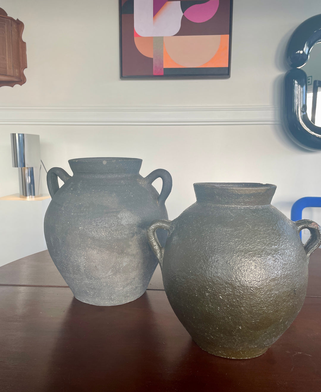 Antique black pottery from Catalunya, Spain.  Originally made to transport cold water these jugs are now considered cultural treasures and used as decorative objects to add personality and character to interiors. Great patina with soft green undertones.