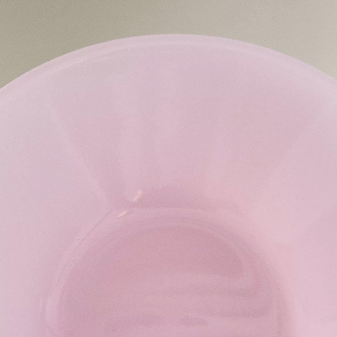Pink glass bowl by Nanushka with a smooth surface.
