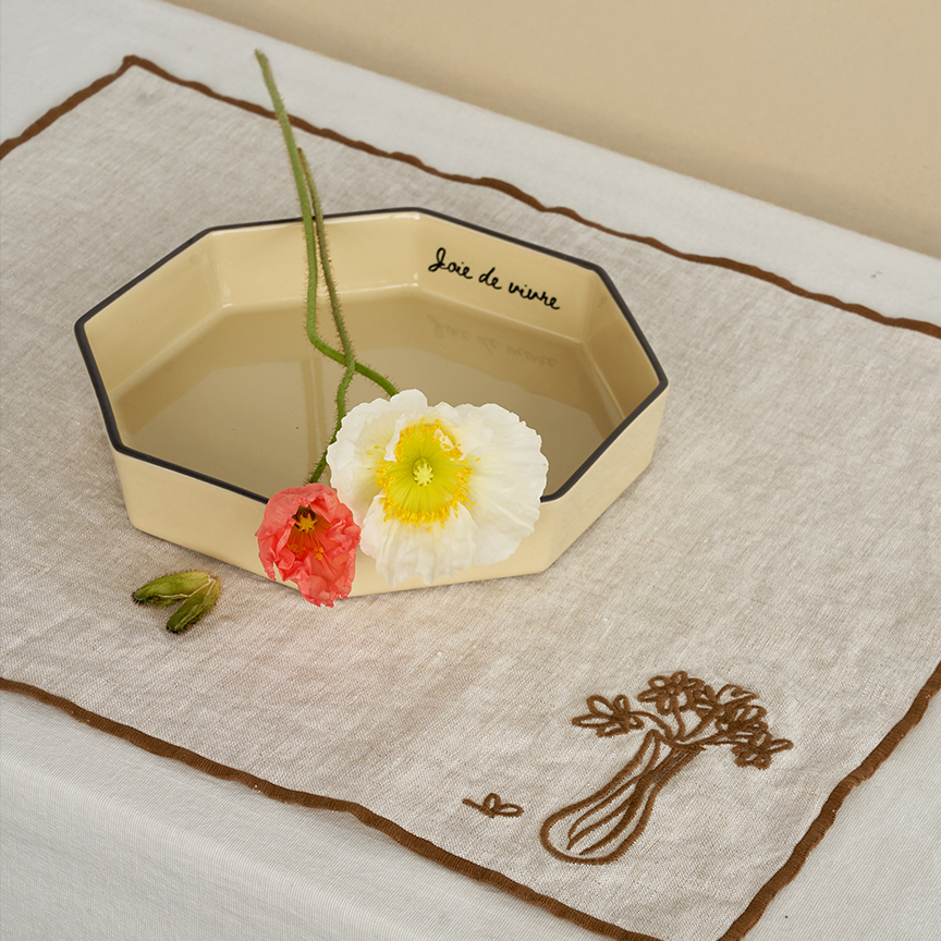 Editorial image of the Gem bowl in Wheat by Black Blaze with some poppies in it, available from Shop Dessein Parke