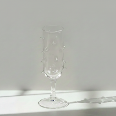 Clear glass with cactus design on a white surface