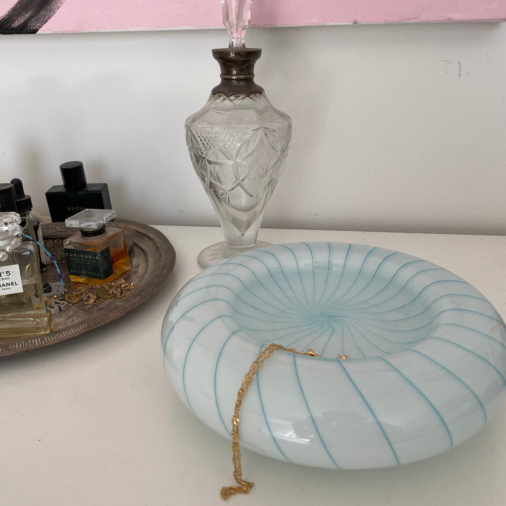 Vintage blue striped Murano bowl from Italy, circa 1960s, with a gold chain resting inside.
