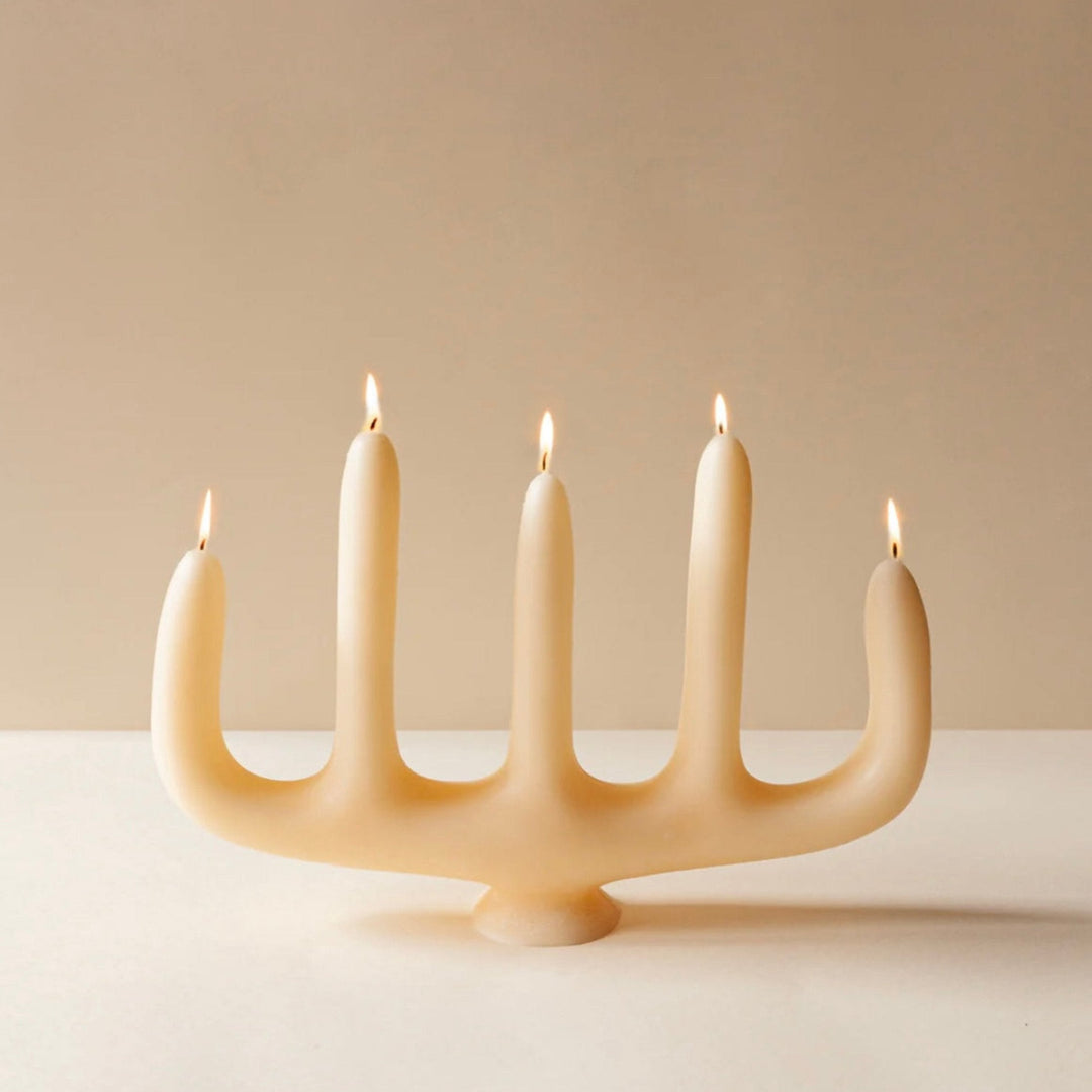 Cream coloured candelabra with five points