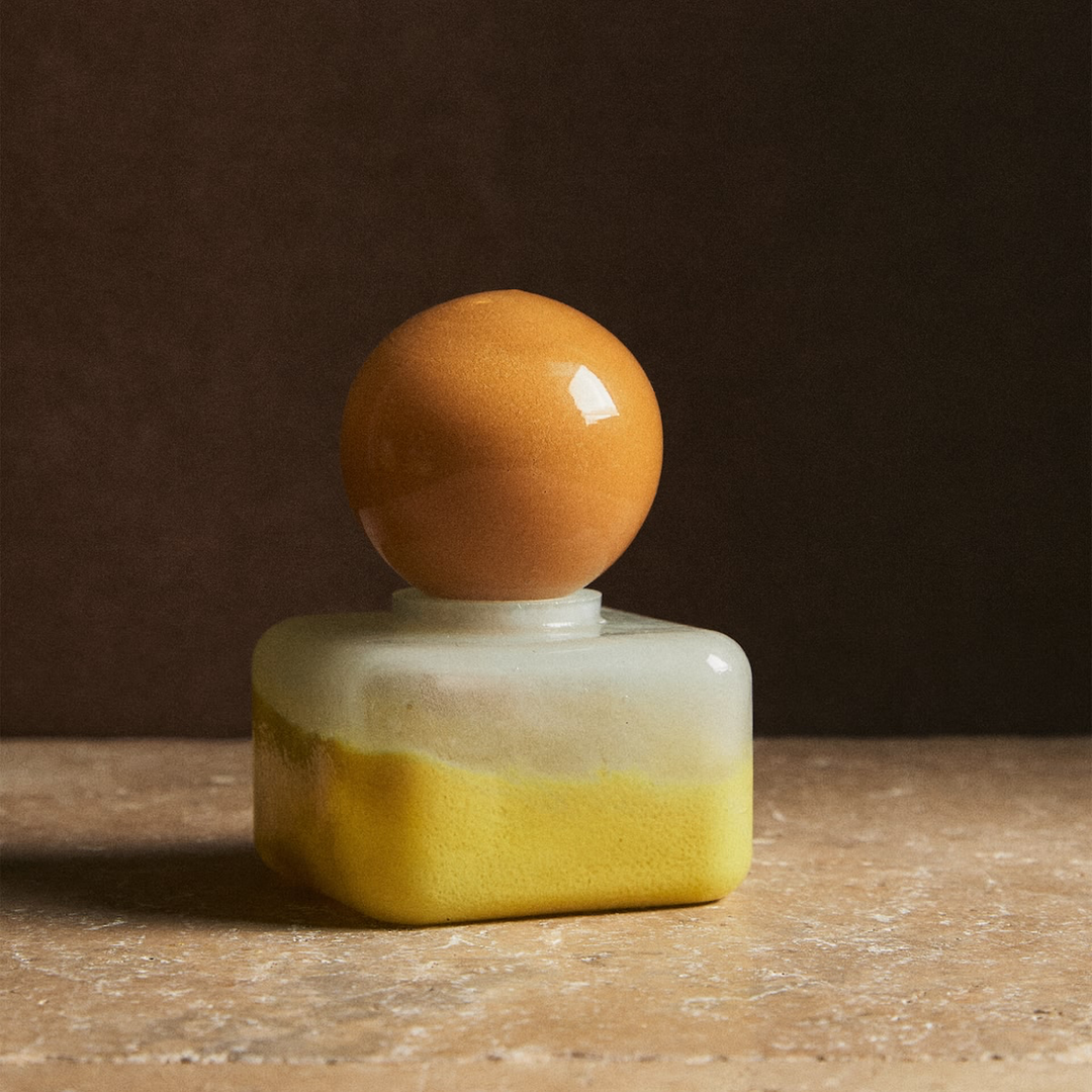 Nanushka painted glass bottle Decorative bottle with a yellow base and orange top