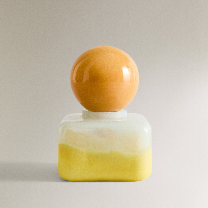 Nanushka painted glass bottle Decorative bottle with a yellow base and orange top