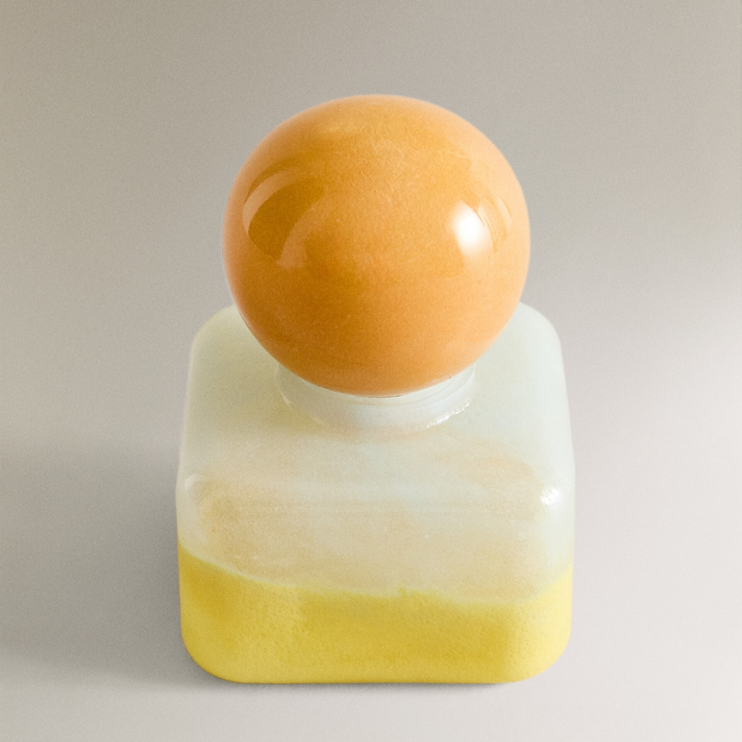 Nanushka painted glass bottle Decorative bottle with a yellow base and orange top