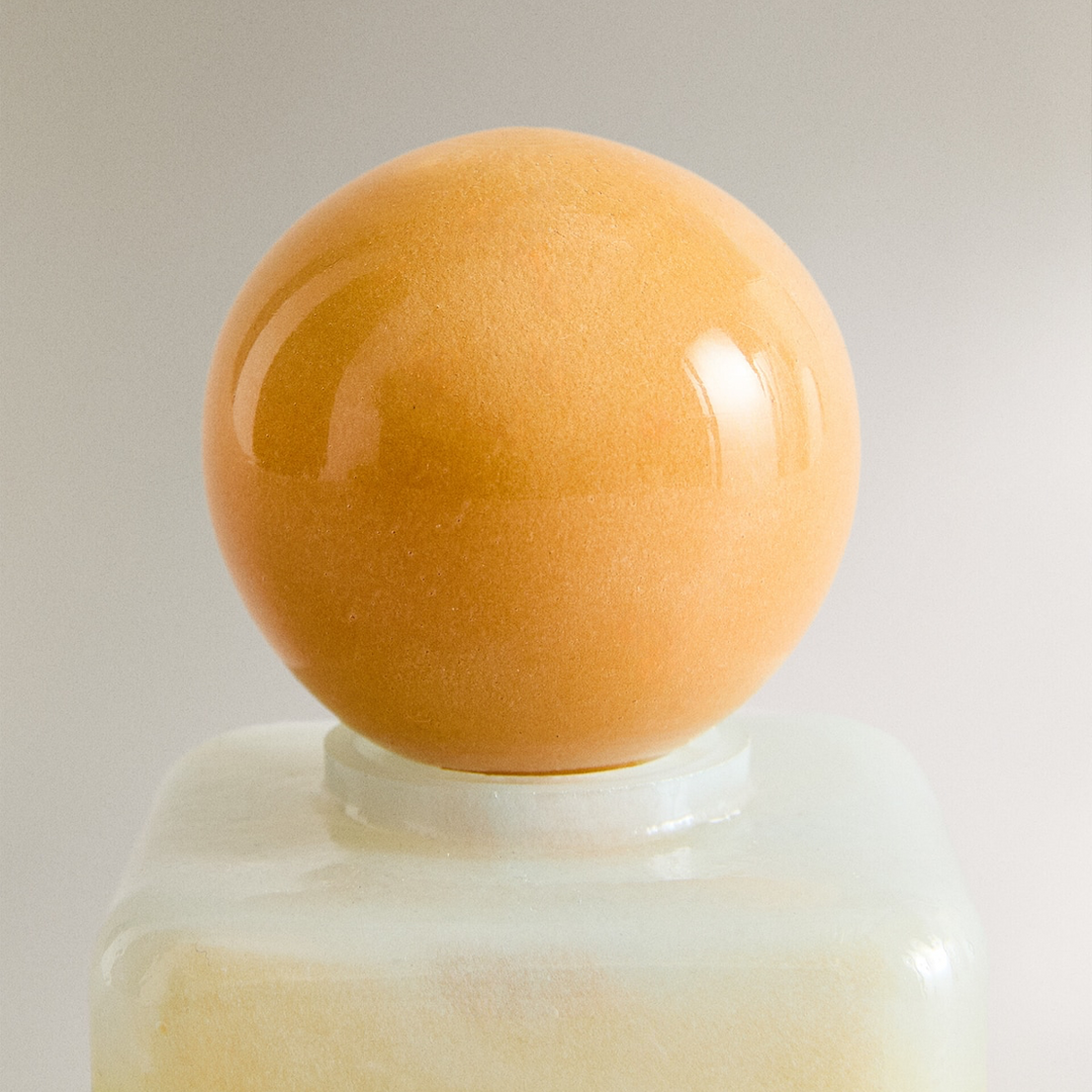 Nanushka painted glass bottle Decorative bottle with a yellow base and orange top