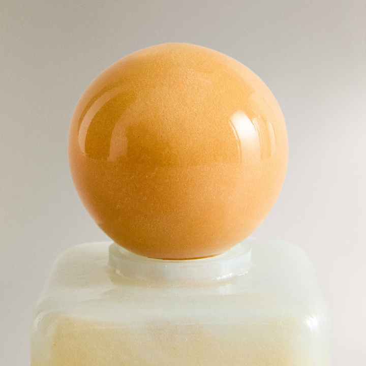 Nanushka painted glass bottle Decorative bottle with a yellow base and orange top