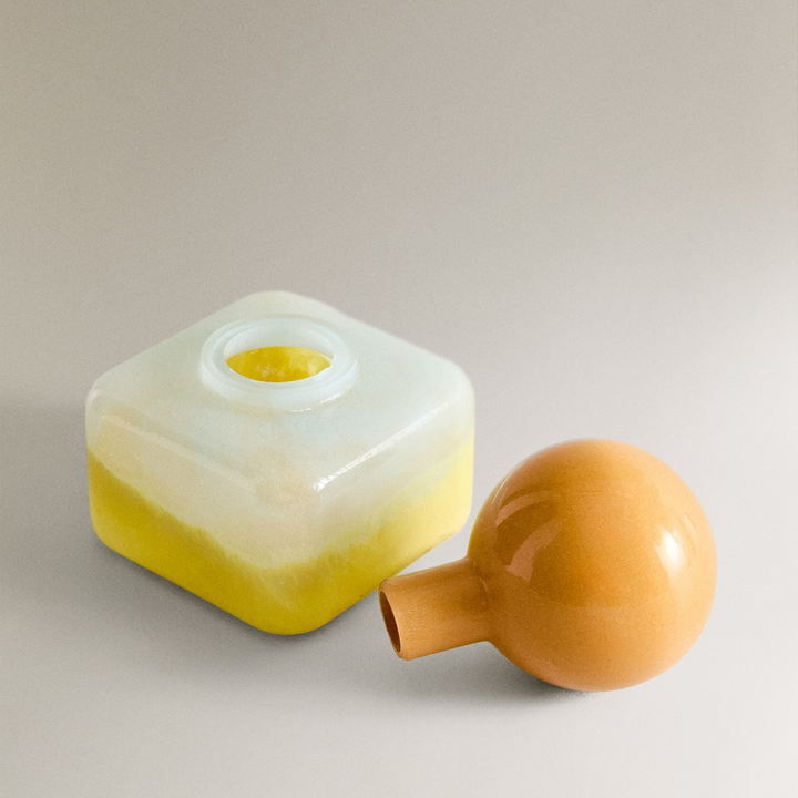 Nanushka painted glass bottle Decorative bottle with a yellow base and orange top