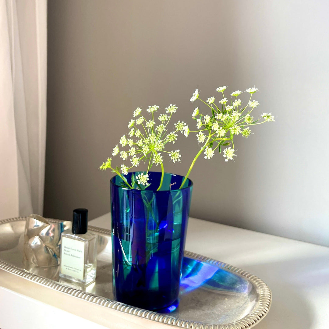 Dark Blue and light blue striped murano drinking glass with flowers in it