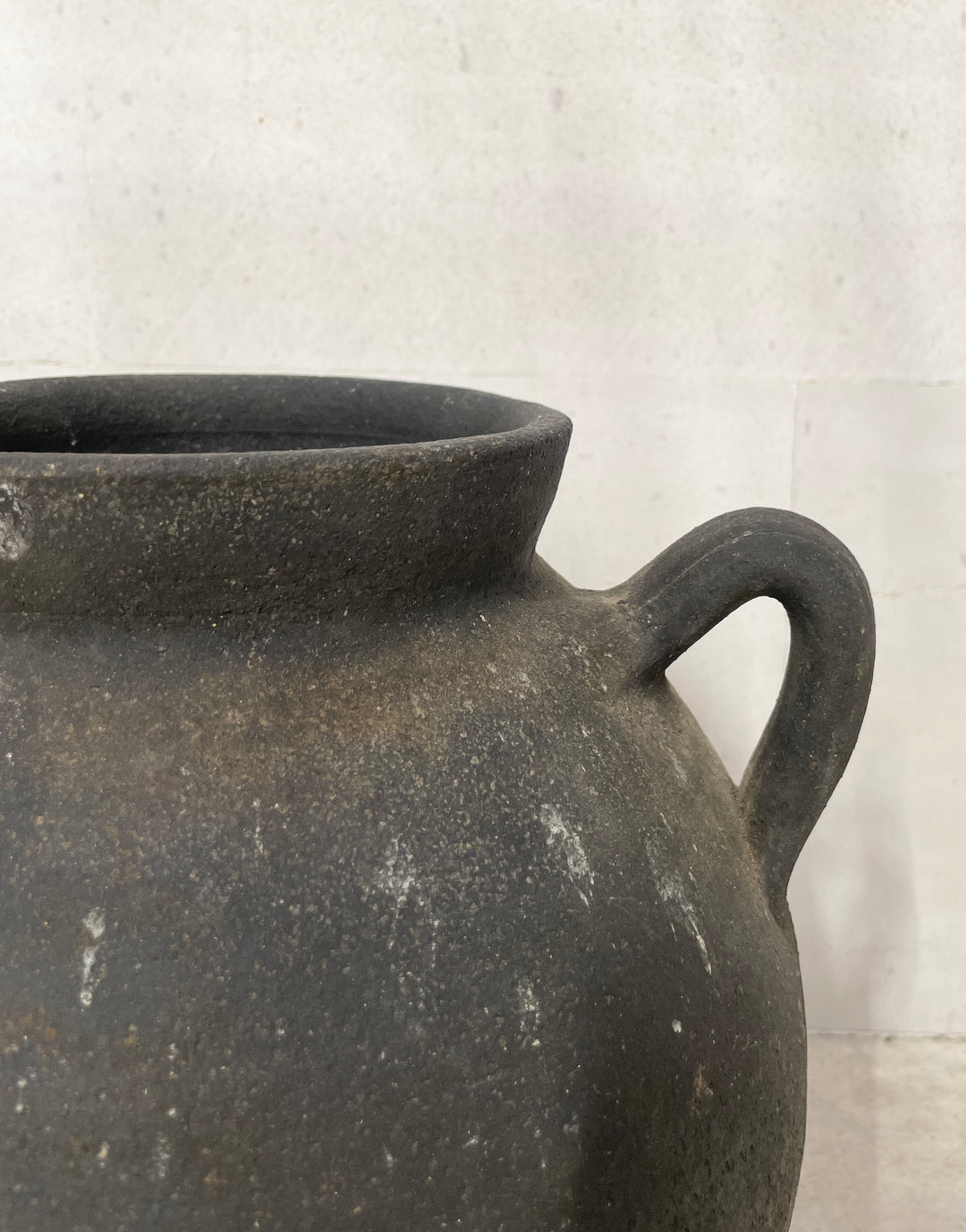Antique black pottery from Catalunya, Spain.  Originally made to transport cold water these jugs are now considered cultural treasures and used as decorative objects to add personality and character to interiors. Great patina with soft green undertones.