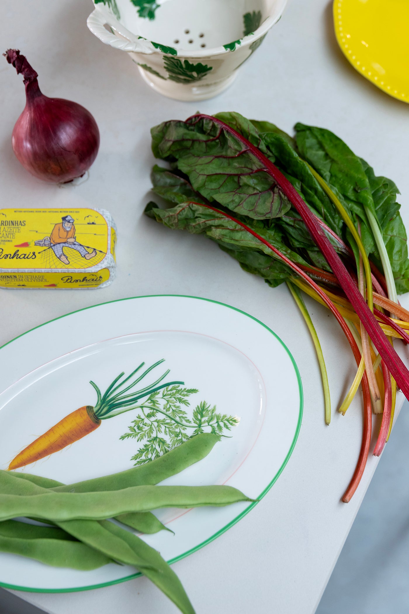 carrot print plate with beans on it