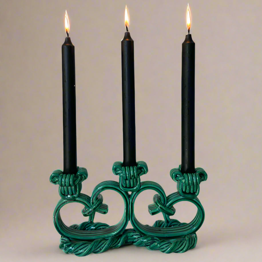 Green ceramic candelabra from Vallauris, France with a rope texture and decorative knot design.