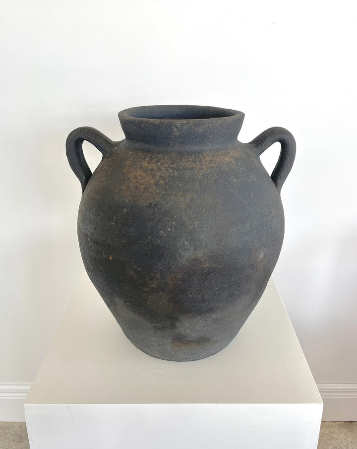Antique black pottery from Catalunya, Spain.  Originally made to transport cold water these jugs are now considered cultural treasures and used as decorative objects to add personality and character to interiors. Great patina with soft green undertones.