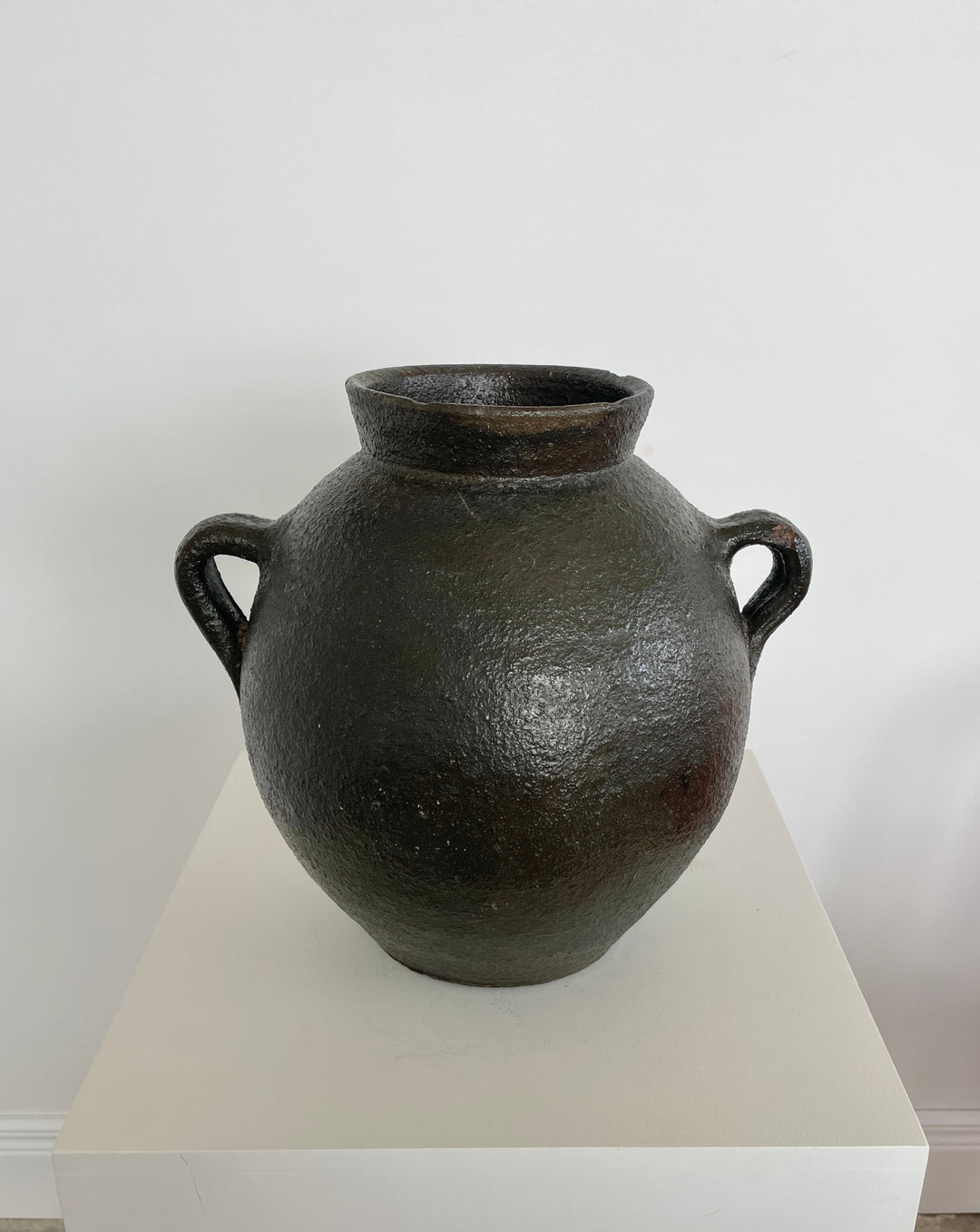 Antique black pottery from Catalunya, Spain.  Originally made to transport cold water these jugs are now considered cultural treasures and used as decorative objects to add personality and character to interiors. Great patina with soft green undertones.