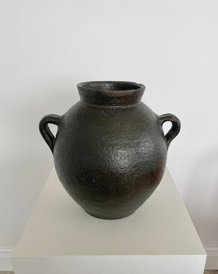 Antique black pottery from Catalunya, Spain.  Originally made to transport cold water these jugs are now considered cultural treasures and used as decorative objects to add personality and character to interiors. Great patina with soft green undertones.