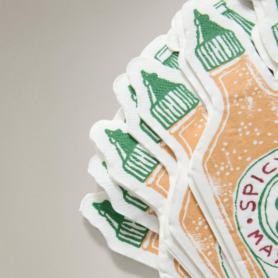 Pack of paper napkins with sauce bottle design by Talking Tables with green and orange accents.