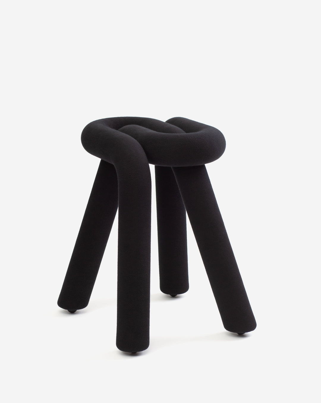 Black stool with knot design by Moustache, featuring a soft texture and three legs with small wheels.