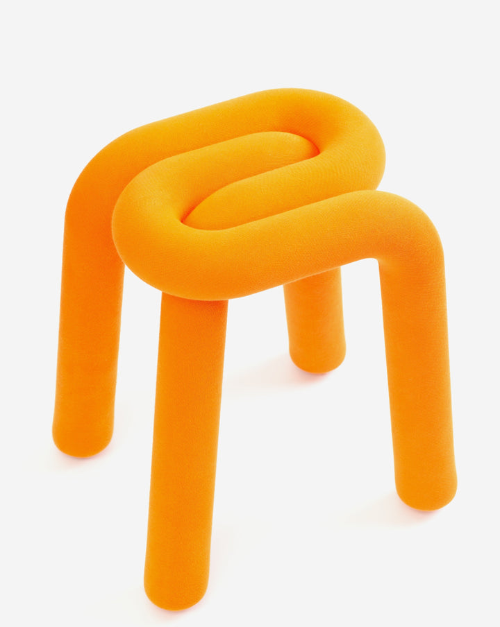 Orange upholstered stool from Moustache featuring a tubular frame with a looped seat and cylindrical legs.