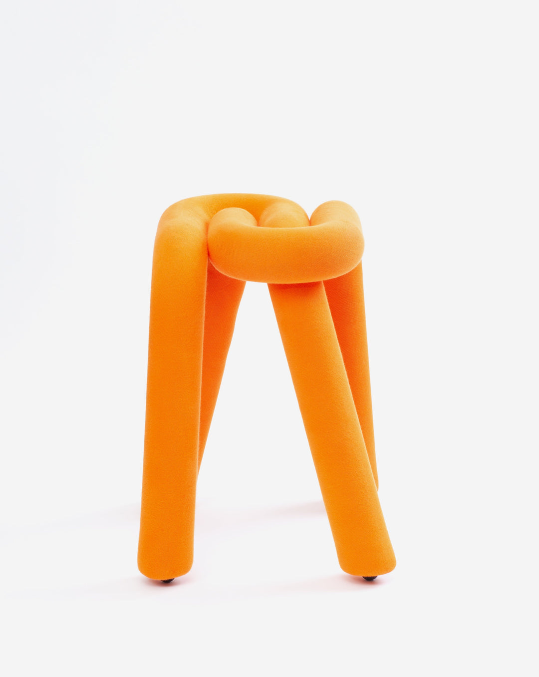 Orange fabric stool by Moustache, with a round knotted top and three cylindrical legs.