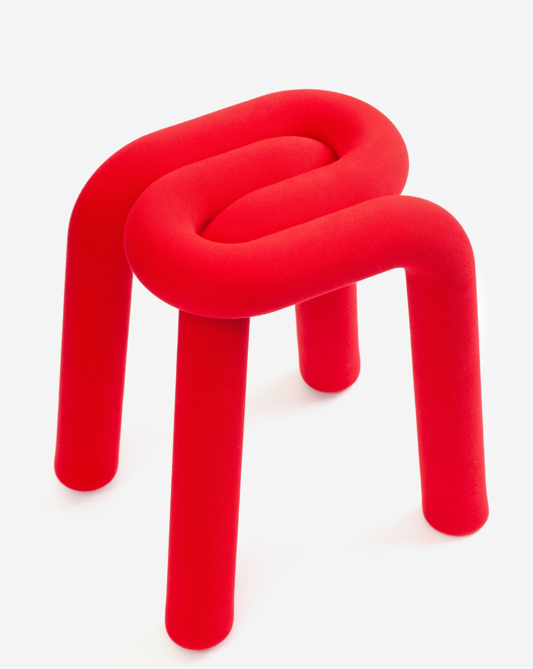 Red upholstered stool with tubular design by Moustache, featuring a soft, textured fabric.