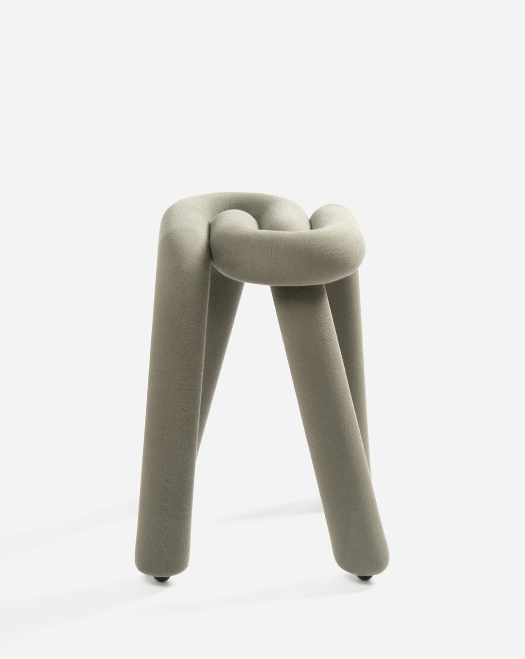 Upholstered stool by Moustache, featuring a soft fabric texture and a unique knot design.