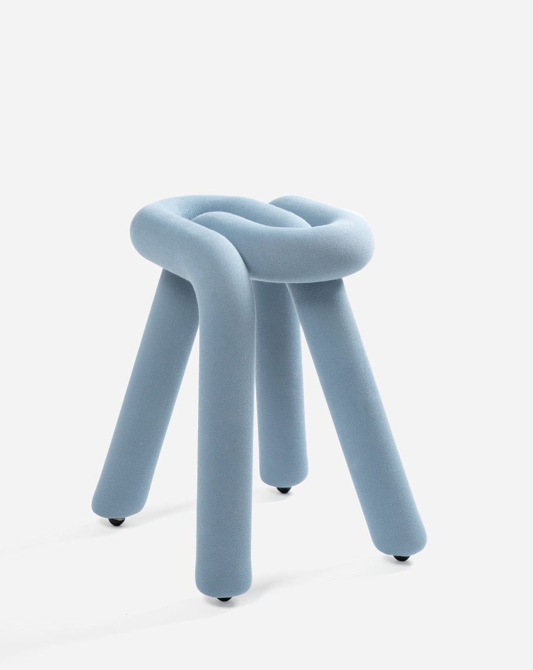 Blue upholstered stool by Moustache with a knotted seat and cylindrical legs.