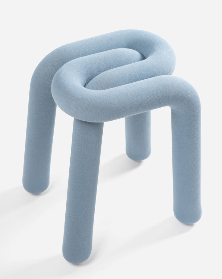 Light blue stool by Moustache with a continuous, curved seat and legs.