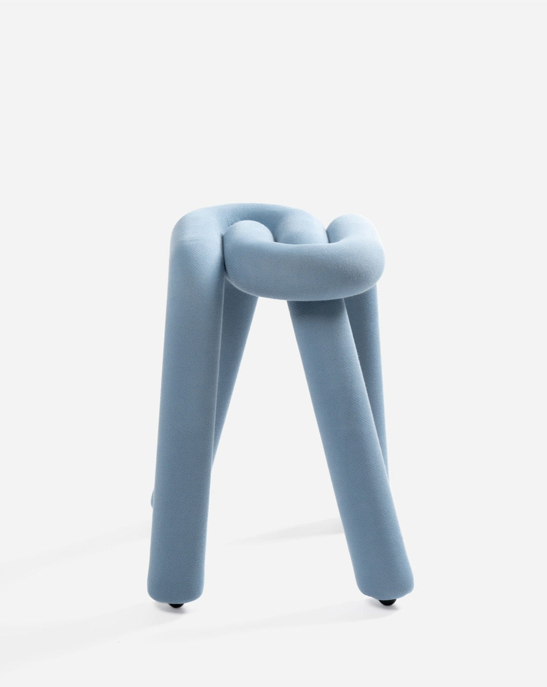 Blue upholstered stool by Moustache, featuring a unique knot design.