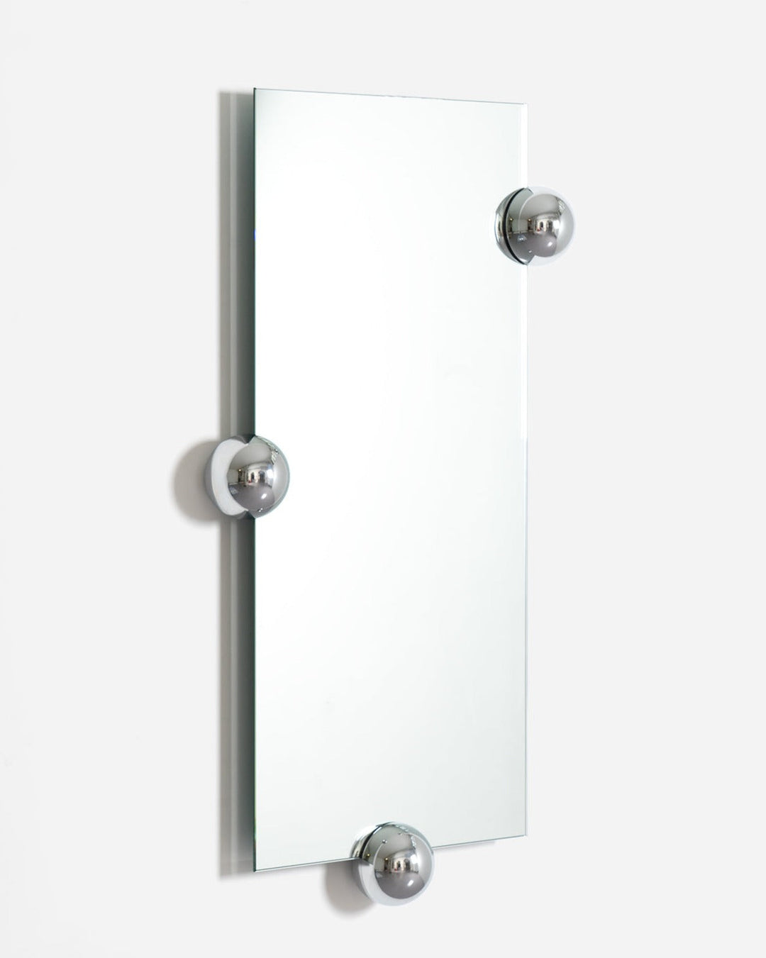 Rectangular wall mirror by Moustache Paris with chrome spherical accents.
