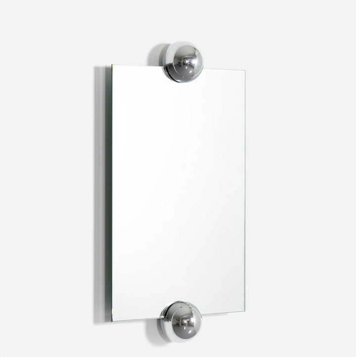 Rectangular wall mirror by Moustache Paris with chrome sphere accents at the top and bottom.
